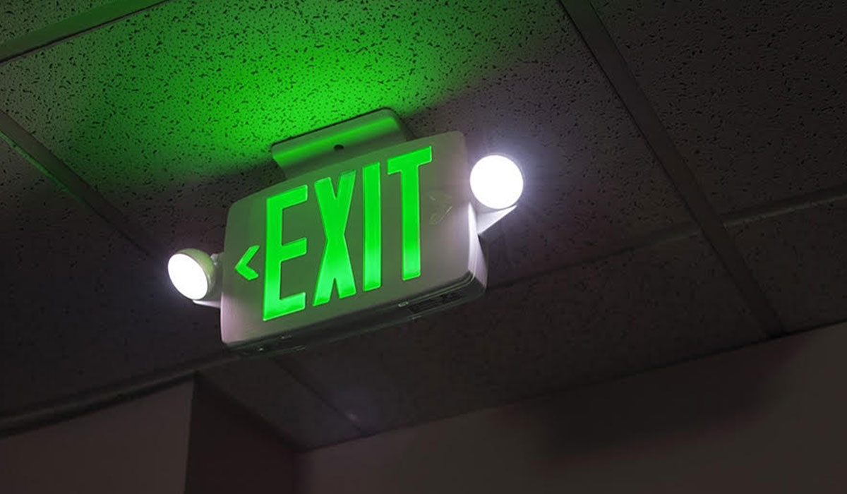 illuminated green exit sign
